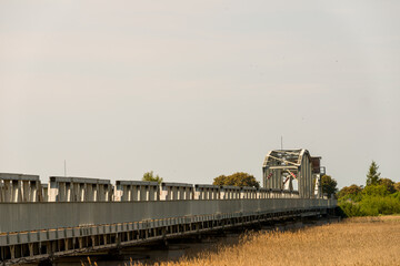 Closeup shot of a bridge in the natural landscape under a gloomy sky