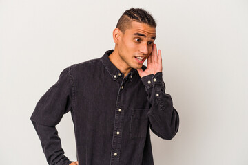 Young venezuelan man isolated on white background shouting excited to front.