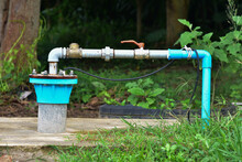 The Water Flowing Artesian Well From The Land Install The Pump Ready To Use