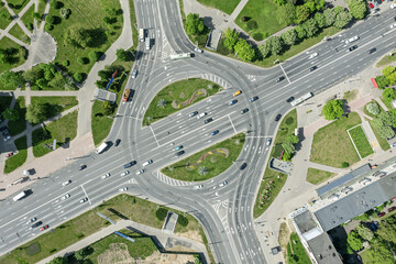 Wall Mural - roads with roundabout and traffic of cars. aerial top view from flying drone