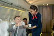 Air hostess takes care of passengers in planes,flight attendants serve on board.