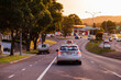 © Austockphoto - Car in heavy traffic with break lights on at sunset on multi lane road