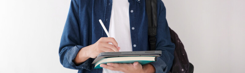Wall Mural - close up of man hand writing on digital tablet while working at home, online study, telecommunicatio