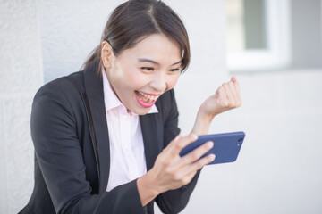 Poster - Asian businesswoman use smartphone