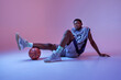 © Nomad_Soul - Basketball player poses with ball in studio