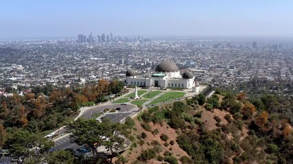 Wall Mural - Arial, epic view of the Los Angeles cityscape and Griffith Observatory, drone view