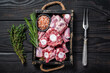 © Vladimir - Raw veal beef Oxtail Meat in wooden tray with thyme. Black wooden background. Top view