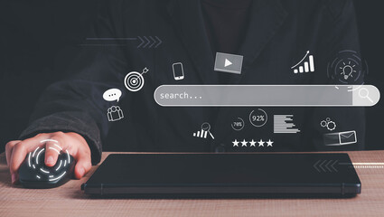 Search Engine Optimization (SEO) concept. Businessman user laptop to search engine  tool. Find customers or promote and advertise on online content for technology, marketing or analytics and business.