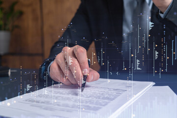 Wall Mural - A client in formal wear is signing the contract to invest money in stock market. Internet trading and wealth management concept. Forex and financial hologram chart over the desk.