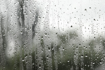 Window glass with raindrops as background, closeup