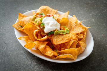 Sticker - nachos tortilla chips with jalapeno, guacamole, tomatoes salsa and dip