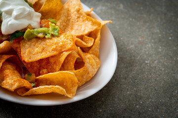 Sticker - nachos tortilla chips with jalapeno, guacamole, tomatoes salsa and dip