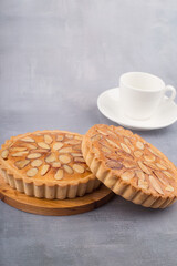 almond homemade two tart on gary background.