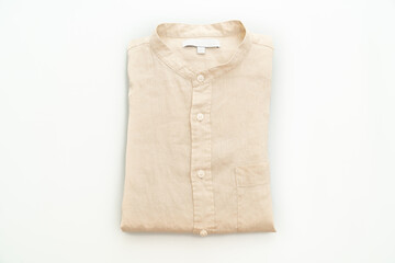 Wall Mural - beige shirt fold on white background