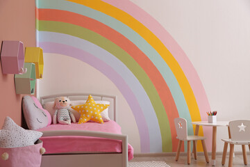 Wall Mural - Cute child's room interior with beautiful rainbow painted on wall