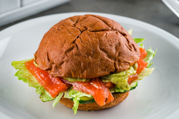 Sticker - close up of Healthy Salmon Burger with Avocado served