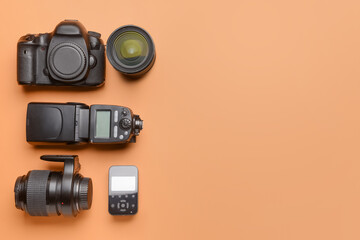 Poster - Modern photographer's equipment on color background