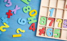 Colorful Numbers On Blue Wooden Table. Education