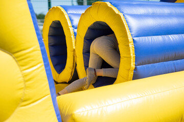 Inflatable tube. Rest obstacle course. Inflatable structure for fun.