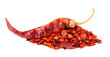 Dried red chili flakes with seeds, isolated on white background. Chopped chilli cayenne pepper. Spices and herbs.