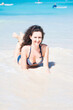 © Fyle - Beautiful girl laying on the beach in Caribbean