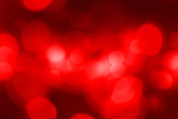 Wall Mural - beautiful red bokeh of lights on dark background