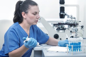 Wall Mural - Professional scientists taking samples for a medical experiments. Researcher working in laboratory