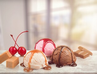 Wall Mural - Scoops of different ice creams and ingredients on a background