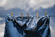 Blue Jeans Drying On Wash Or Clothes Line.