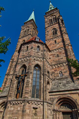 Poster - Low angle of St. Sebald medieval church of Nuremberg in Germany under the clear blue sky