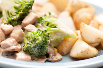 Wall Mural - Closeup shot of a homemade stir fry beef, potatoes with broccoli