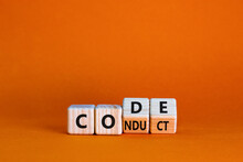 Code Of Conduct Symbol. Turned The Wooden Cube And Changed The Word Code To Conduct. Beautiful Orange Background. Business And Code Of Conduct Concept. Copy Space.