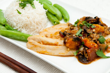 Wall Mural - Closeup shot of rice, green beans, and fried vegetables on a white plate