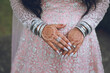 Indian bride's wedding outfit, jewellery, henna mehendi mehndi hands close up