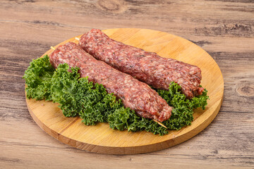 Raw minced beef kebab skewer