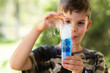 © Austockphoto - 6school kid doing science experiment with dry ice, water and soap