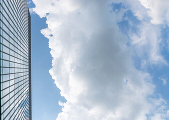 Companies buildings. Finance corporate architecture city in abstract blue sky with nature cloud in sunny day. Modern office business building with glass, steel facade exterior.