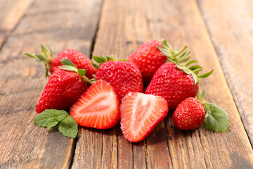 Wall Mural - fresh strawberry fruit on wood background