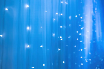 Wall Mural - blurred focus of decorative lights in blue background