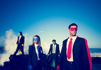 Business superheroes on the beach.