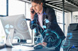 © VideoFlow - Businessman in suit has conference call to optimize development by implying new technologies in business process. Interconnections and hi tech hologram over office background with panoramic windows