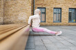 © Drobot Dean - Middle eastern woman in hijab doing exercise while working out