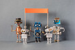 Robots are holding a picket, a strike for the observance of rights. Group of different robots with banner and copy space for text