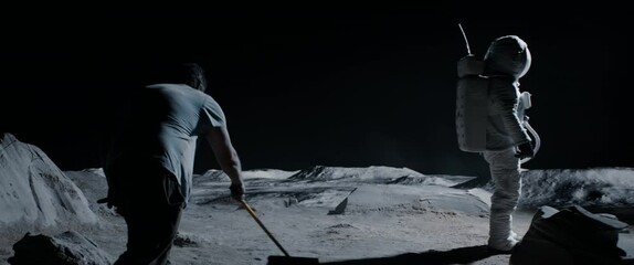 Wall Mural - behind the scenes, actor wearing astronaut suit waiting while film crew decorator straightens lunar 