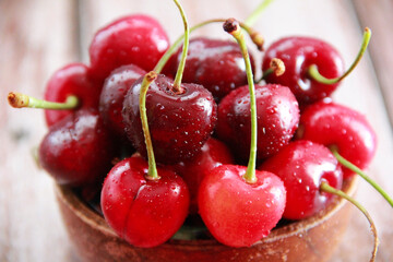 natural red cherry fruit with green peduncle