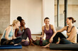 © Drazen - Group of young athletic woman having fun and laughing while relaxing after spots training at health club.