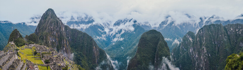 Wall Mural - Panoramic view of famous Machu Picchu lost city from The Door of the Sun . Ruins of ancient inca civilization in the sacred valley of Cusco Province. Peru, South America