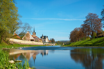 Wall Mural - medieval castle by the river in a small European town