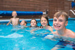 © Louis-Paul Photo - group of children having fun in Pool on the summer time