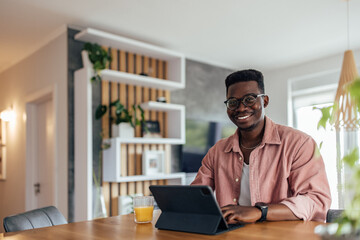 Adult man, posing for the camera, at home office.